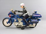 a figurine of a police officer riding a motorcycle