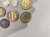 a lot of coins that are sitting on a table