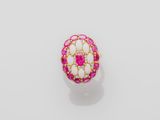 a pink and white stone ring with gold accents