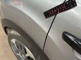 a close up of a car with a ruler on the side of it