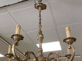 a chandelier that is hanging from the ceiling