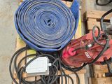 many different types of hoses and other tools on a pallet
