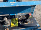 an image of a forklift with a blue box