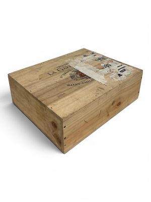 a wooden box with a picture on it on a white background