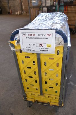 a cart with a lot of boxes on it in a warehouse