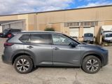 a gray suv parked in a parking lot