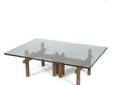 an image of a glass table with wooden legs and a glass top