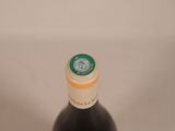a bottle of wine that is sitting on a table