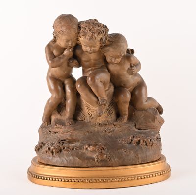 a statue of a group of cherensils on a pedestal