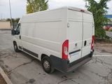 a white van that is parked in a parking lot