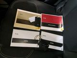 a picture of a car seat with a bunch of cards attached to it