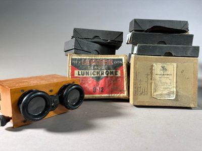 three boxes and a pair of binoculars sitting on top of a table