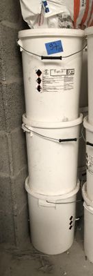 three buckets stacked on top of each other in a room