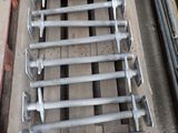 a wooden pallet that has a bunch of bolts on it