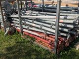 a lot of metal pipes that are stacked on the ground