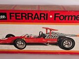 the box is open to show the model of a ferrari formula car