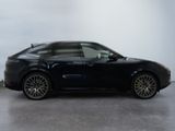 a picture of a black car parked in a garage