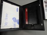 a black folder with a picture of a cat inside of it
