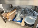 many bags of food sitting on a metal shelf