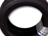a close up of a tire on a white background