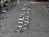 two ladders that are sitting on the floor in a garage