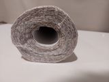 a roll of toilet paper sitting on top of a toilet