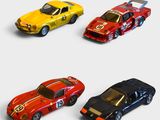 four toy cars are lined up in a row on a white surface