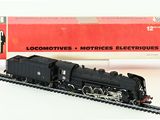 a toy train that is on the tracks next to a box