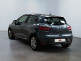 the rear end of a grey car parked in a room