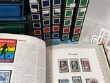 a lot of stamps on the pages of a book
