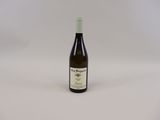 the bottle of wine is sitting on the table ready to be eaten