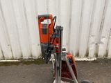 a small machine that is sitting on the side of the road
