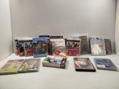 a lot of dvd ' s and games on the table