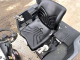 an image of a black seat on a lawn mower