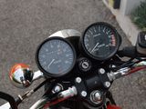 a close up of a motorcycle with a speedometer on it ' s handlebars