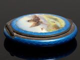 a small blue box with a picture of a woman on it