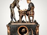 a statue of two men playing a game of chess