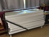 a stack of white plates sitting on top of a table