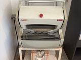 a machine that is sitting on a cart in a room