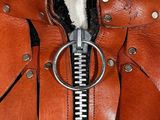a close up of a leather jacket with a zipper on it