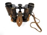 a pair of binoculars that are sitting on a white surface