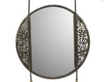 an image of a round mirror with a chain hanging from it