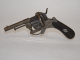 an old gun that is on display on a white surface