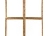 four square wooden frames on a white wall with a white background