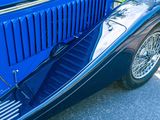a blue car parked on the side of the road