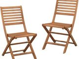 pair of wooden folding chairs against a white background