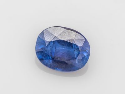 a blue sapphire stone with a white background