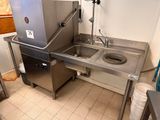 a sink and a counter in a small kitchen