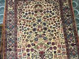 a close up of a rug on a tiled floor in a room