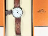 a watch that is sitting in a box on the table